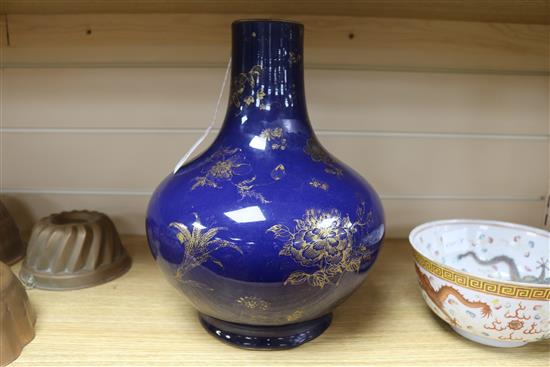 A Chinese Kangxi style dark powder blue ground vase, with gilt decoration of flowers and fruit,